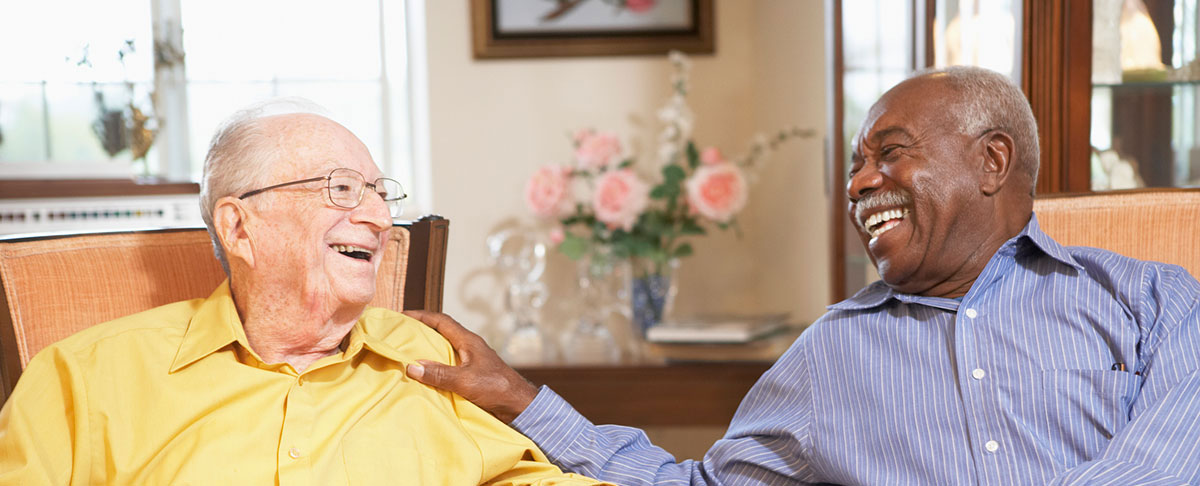 senior men relaxing in armchairs